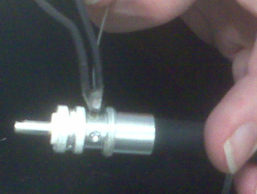 In a similar manner as above, the holes around the outside of the connector are filled with solder.